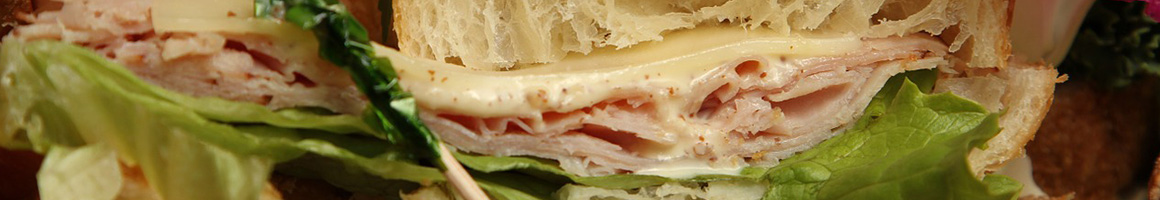 Eating Deli Sandwich at Malibu Kitchen & Gourmet Country Market restaurant in Malibu, CA.